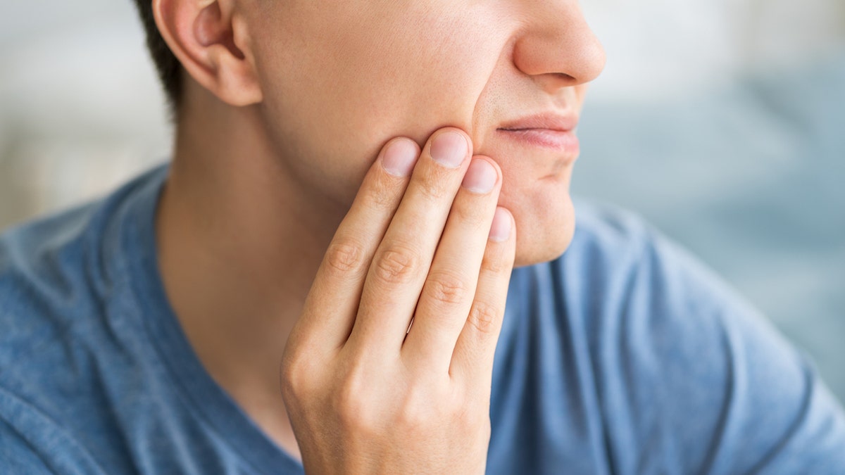 Man grinding teeth