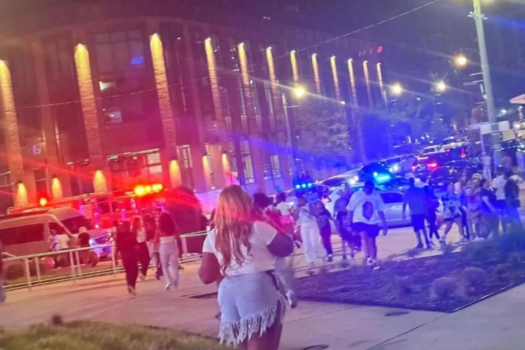 Bystanders and police presence are seen outside of FedExForum after a shooting at Lil Baby's concert.