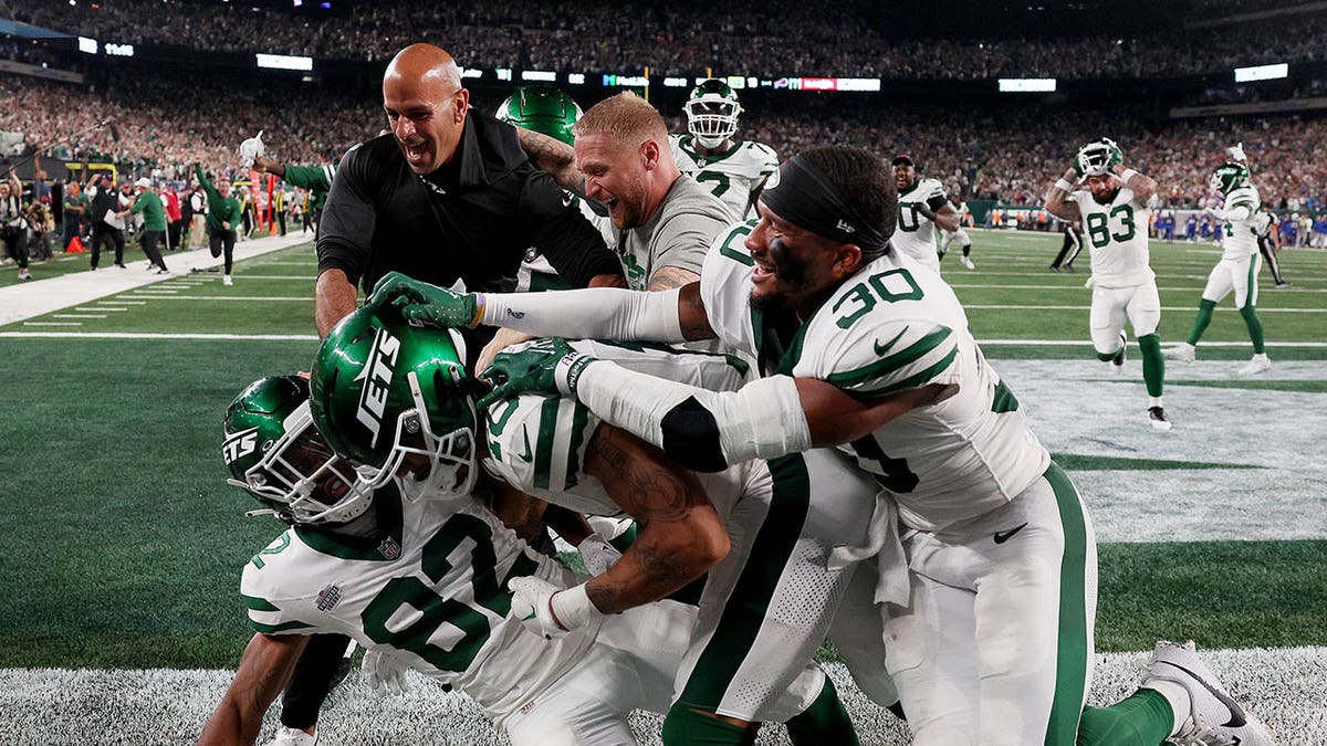 Robert Saleh celebrates in the endzone