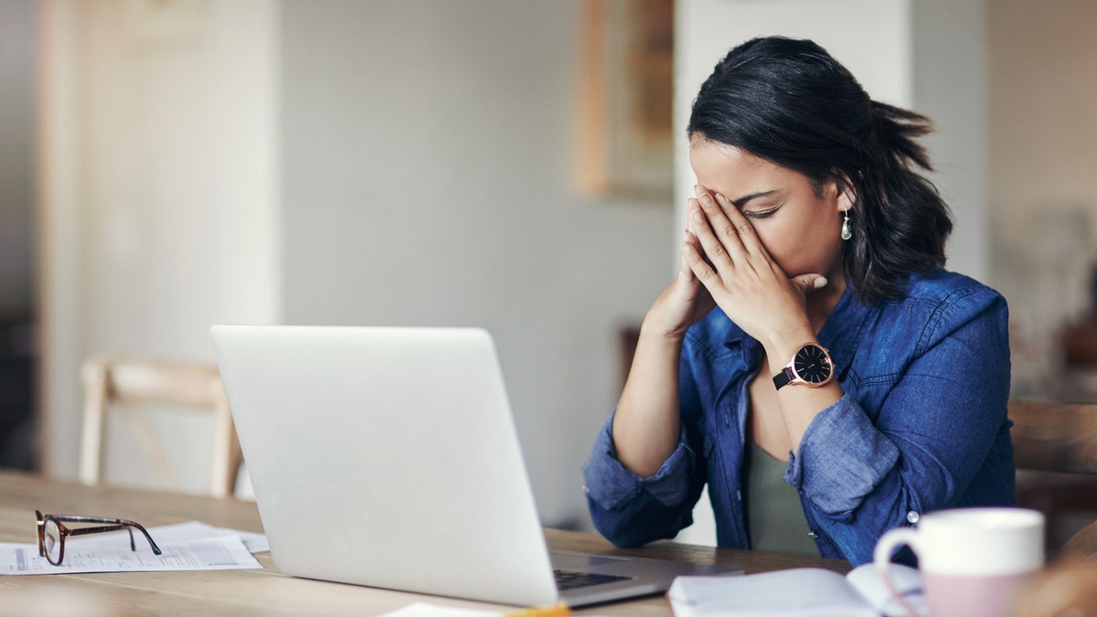 Upset woman on computer