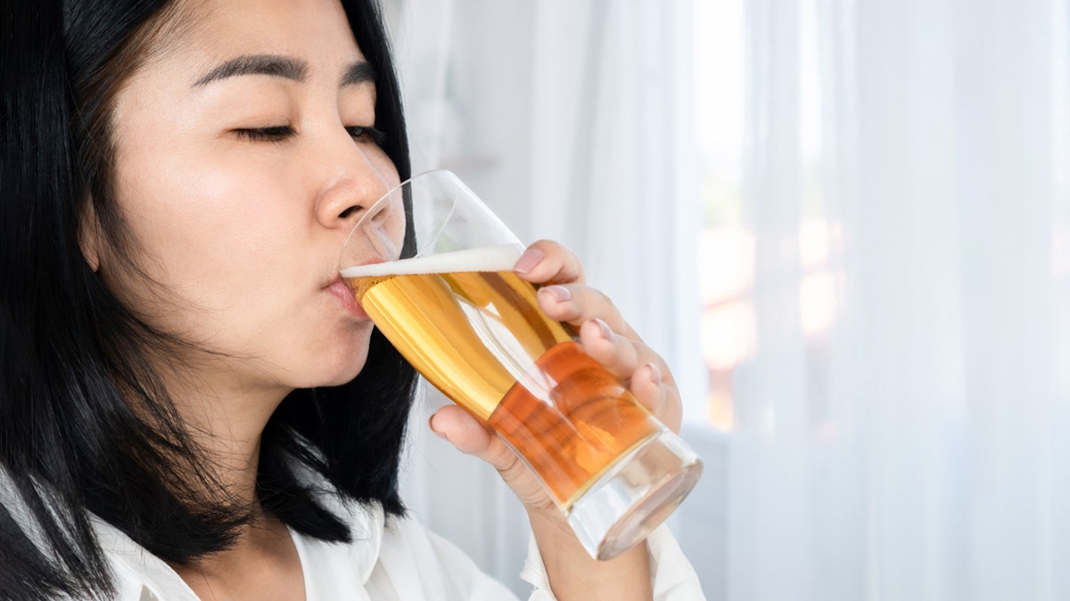 Woman drinking beer