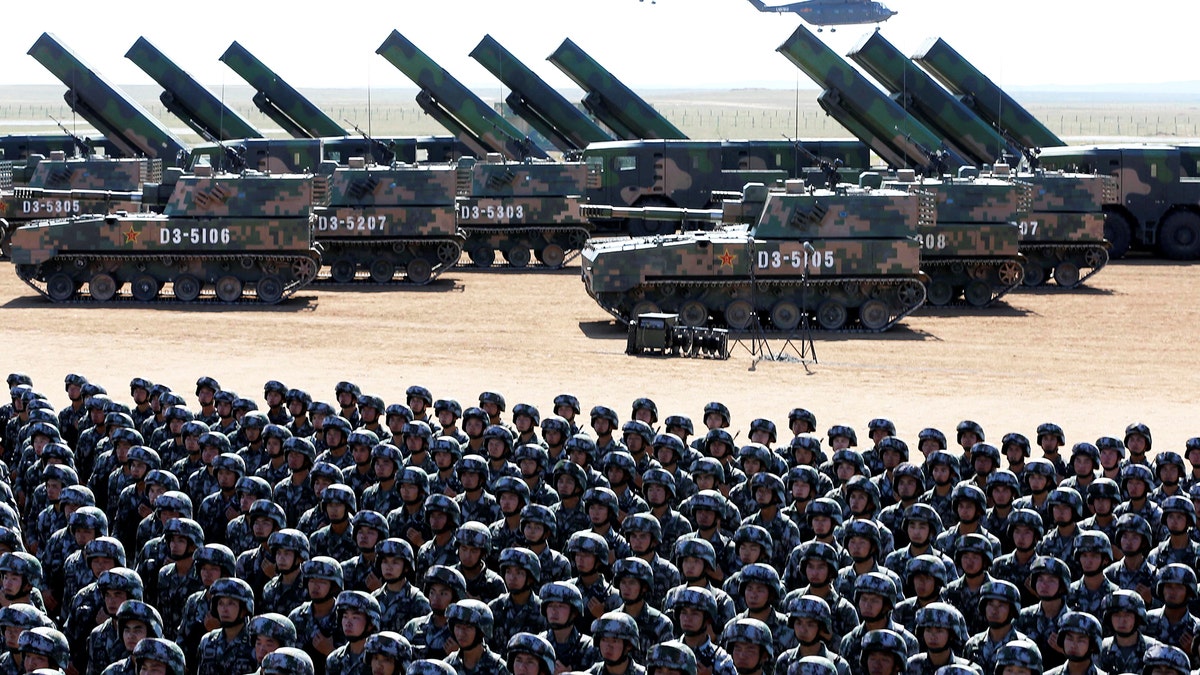 Soldiers of China's People's Liberation Army (PLA) take part in a military parade to commemorate the 90th anniversary of the foundation of the army at the Zhurihe military training base in Inner Mongolia Autonomous Region, China, July 30, 2017. REUTERS/Stringer ATTENTION EDITORS - THIS IMAGE WAS PROVIDED BY A THIRD PARTY. CHINA OUT. NO COMMERCIAL OR EDITORIAL SALES IN CHINA. - RTS19PP2