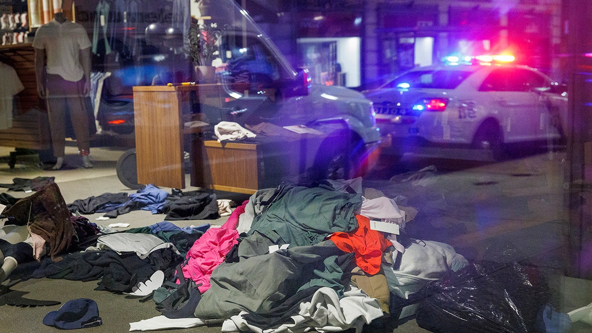 Clothes in a pile outside a Lululemon on a Philadelphia street during mass looting events