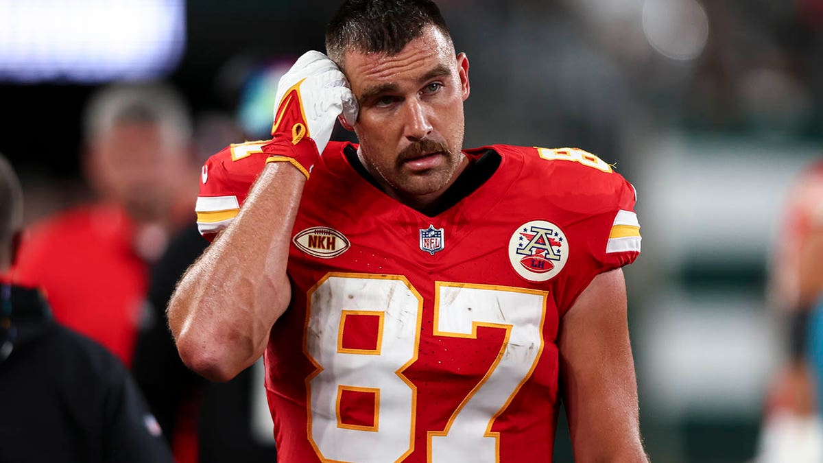 Travis Kelce looks on