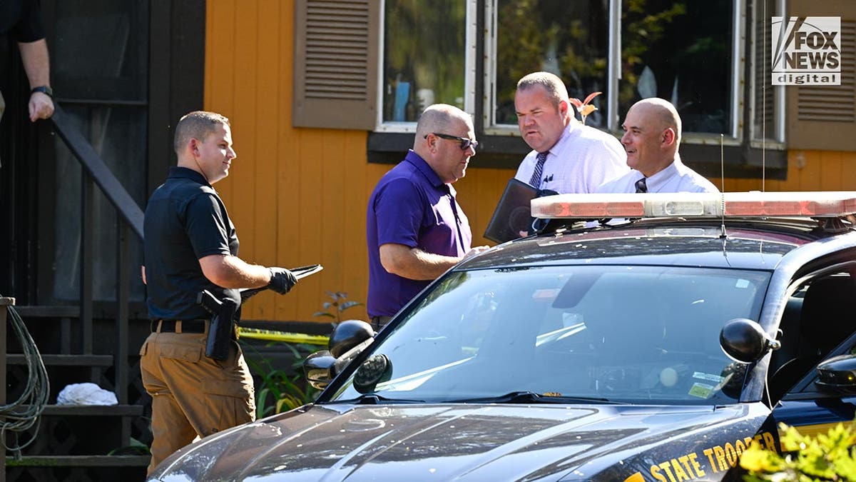 Police outside the home of the The son of the man who allegedly abducted Charlotte Sena