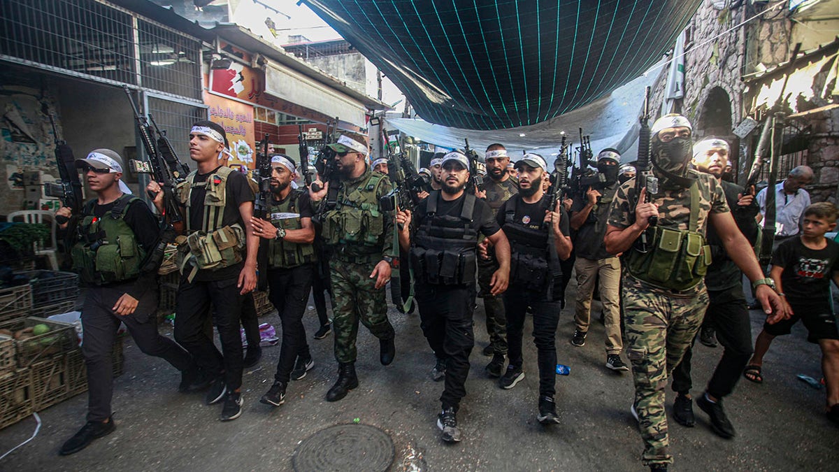 militant fighters holding guns