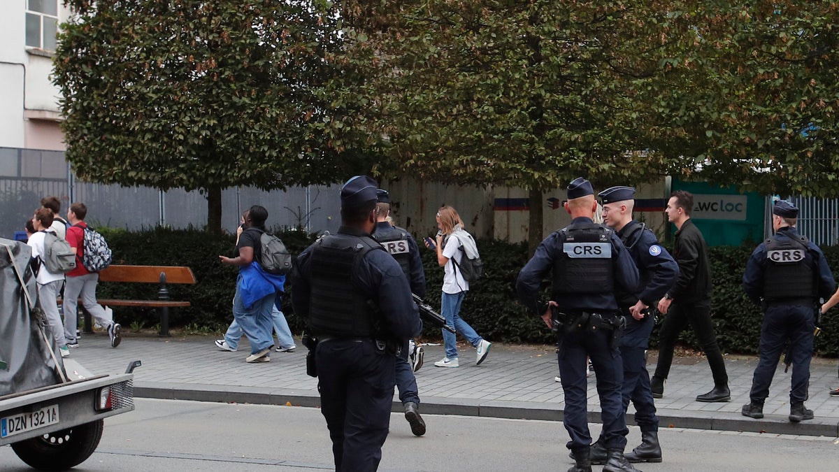 Police escort students after France School Attack