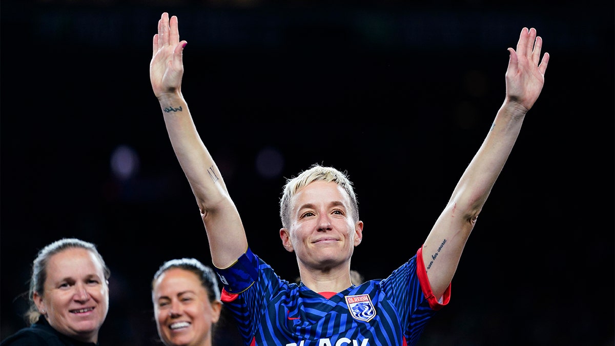 Megan Rapinoe waves to the crowd