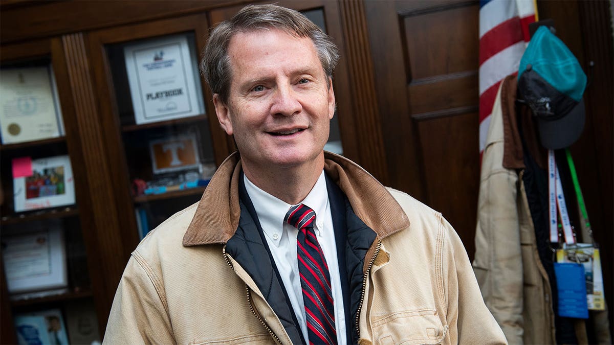 Rep Tim Burchett wearing a tan jacket in a room