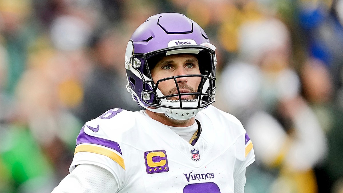 Kirk Cousins looks out on field