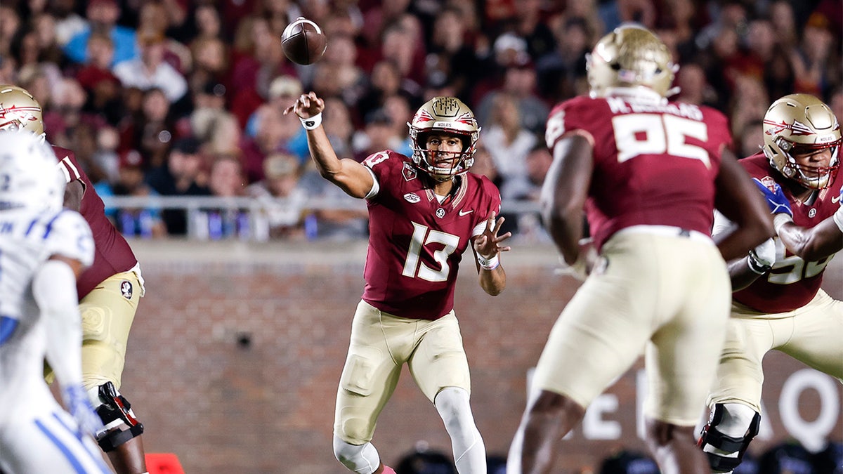 Jordan Travis passes against Duke