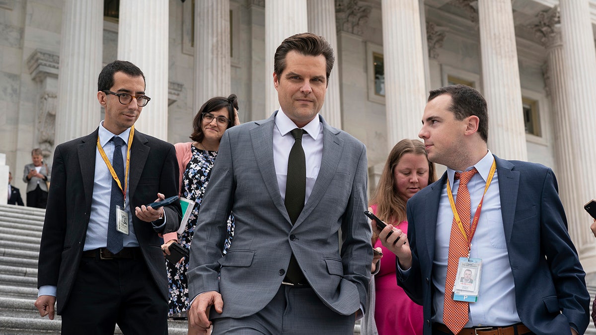 Gaetz surrounded by media