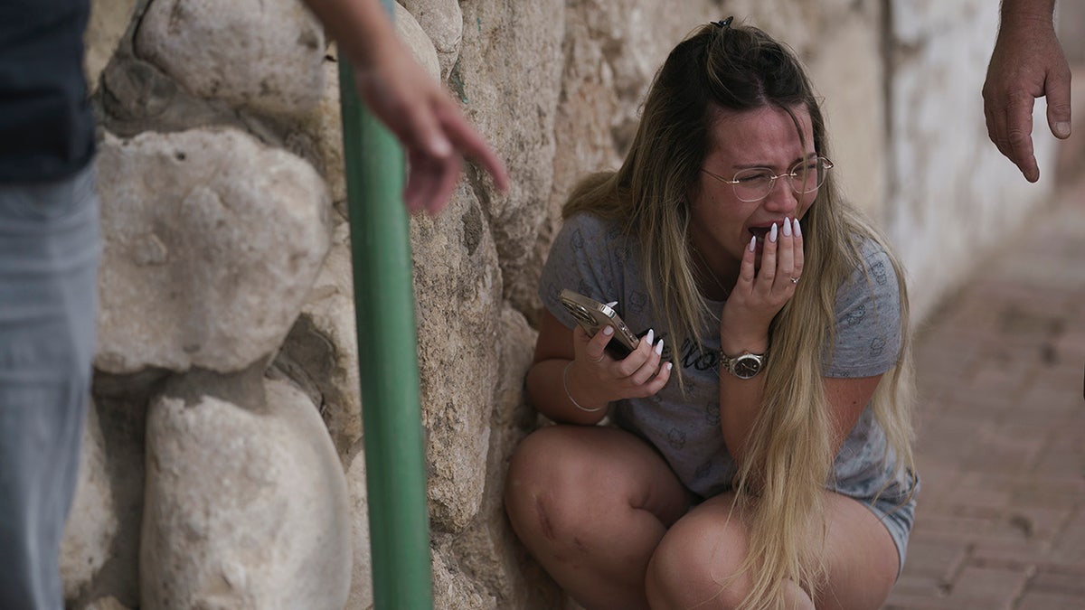 woman crying taking shelter