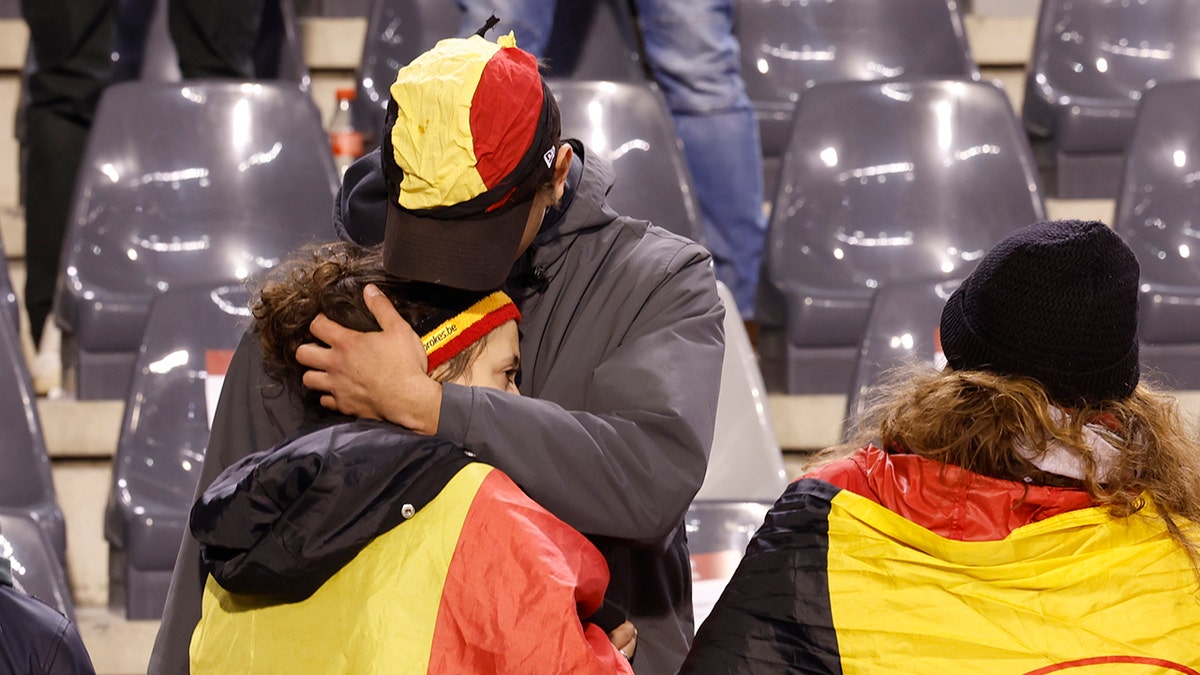 Soccer fans hugging