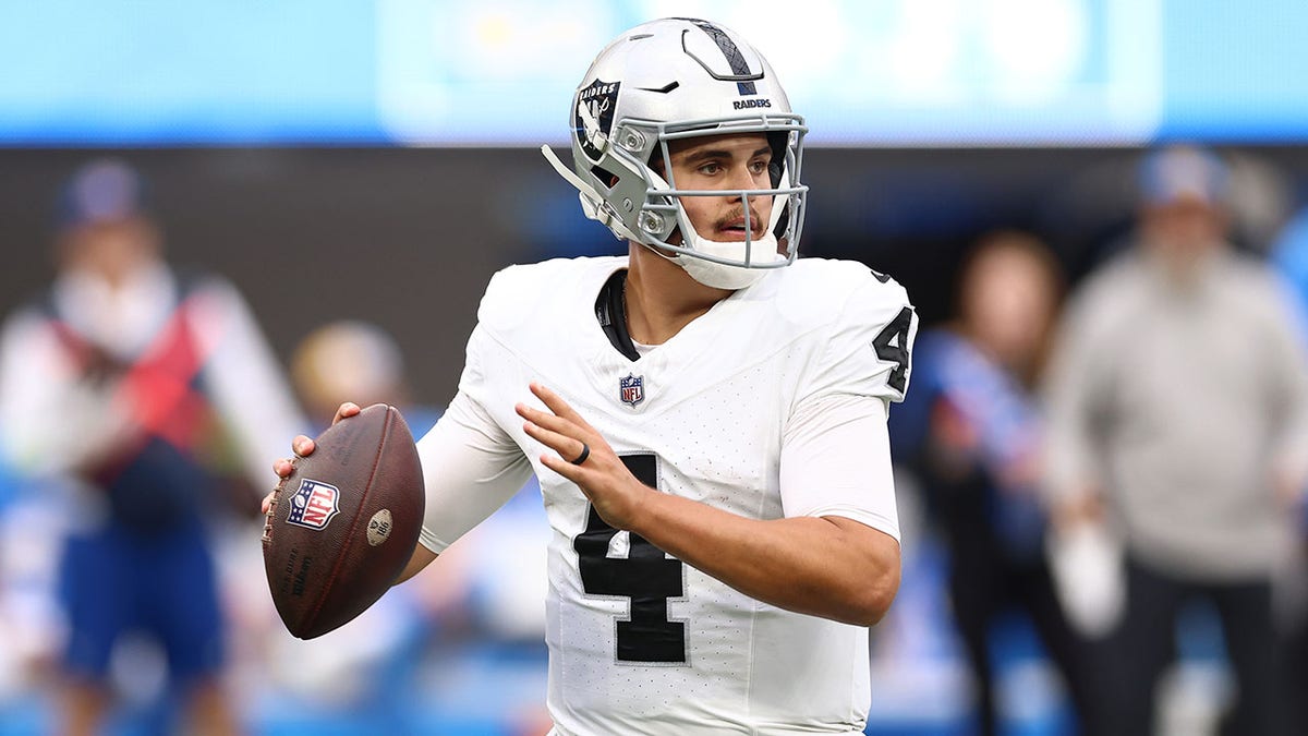 Aidan O'Connell plays during a Raiders game