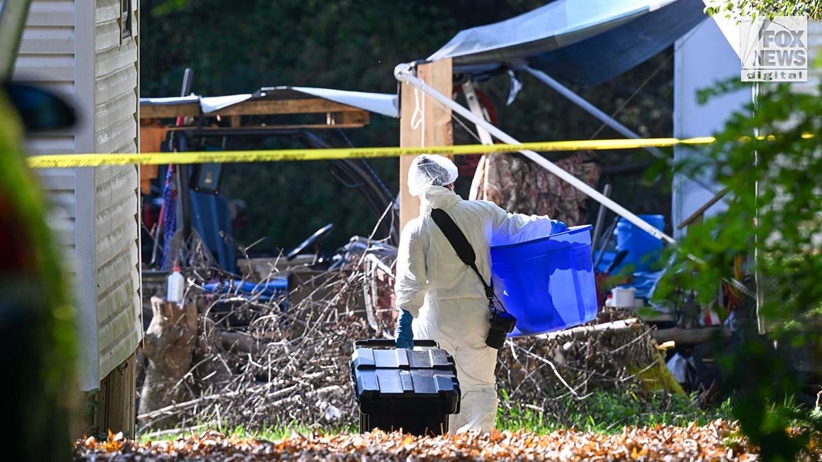 New York State Police collect evidence at the home of Craig Ross Jr.