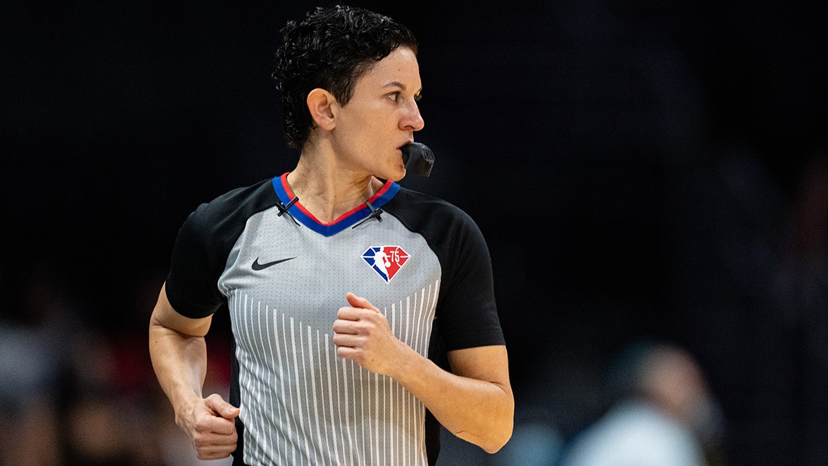 Che Flores officiates during an NBA game