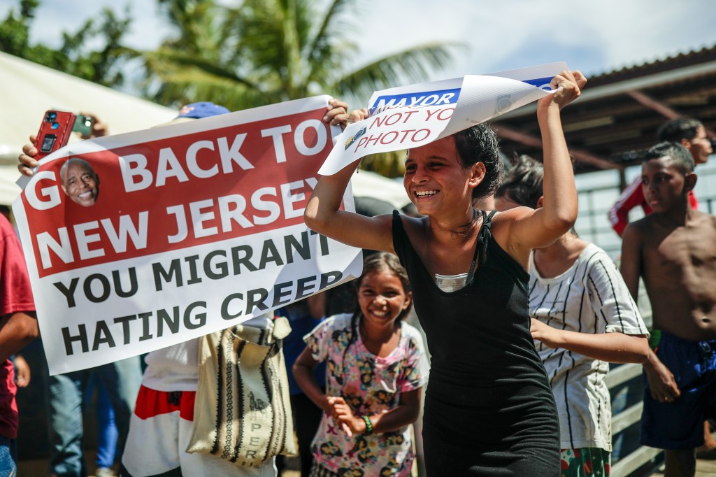 Migrants protest during the visit of New York City Mayor Eric Adams to Necocli, northern Colombia, Saturday, Oct. 7, 2023. 