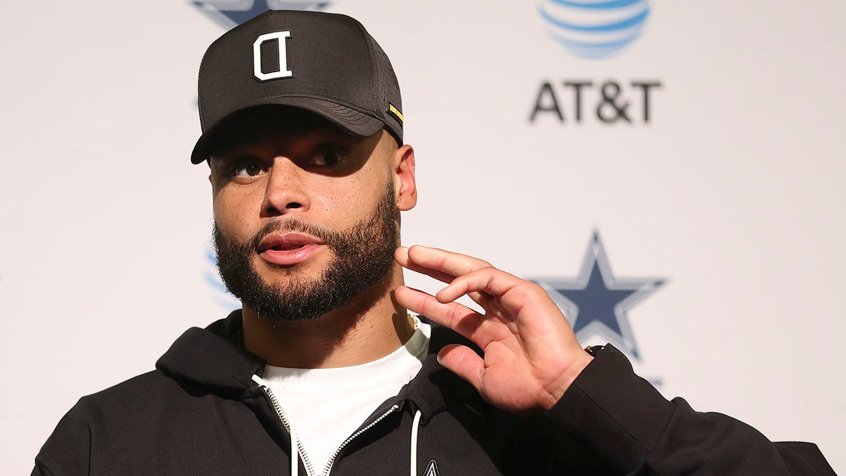 Dak Prescott talks to reporters