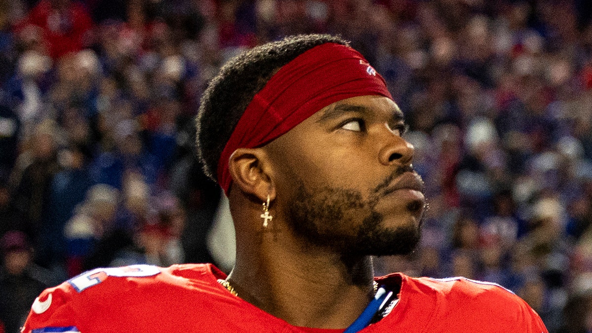 Damien Harris looks on field during national anthem