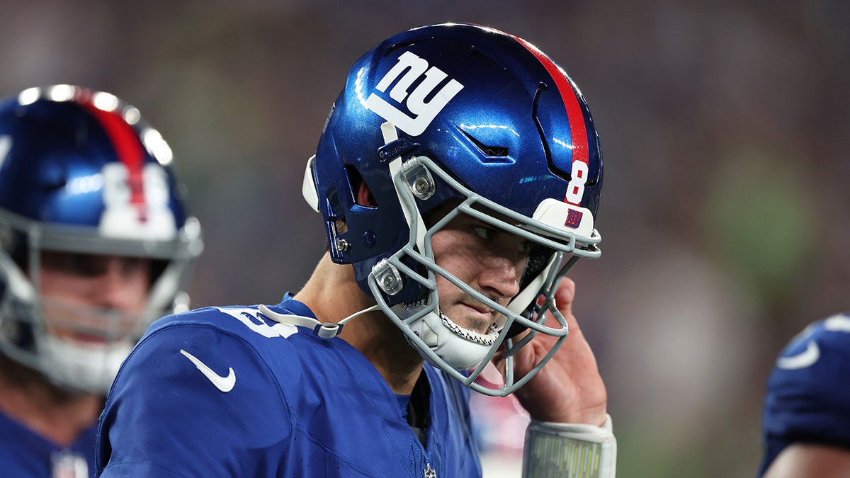 Daniel Jones walks with head down