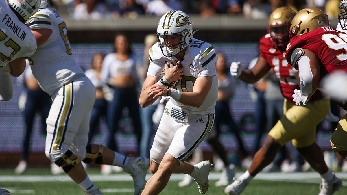 Georgia Tech Yellow Jackets runs with the football