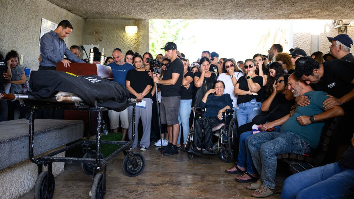 A family mourns at the funeral of a victim killed by Hamas terrorists at the Nova music festival