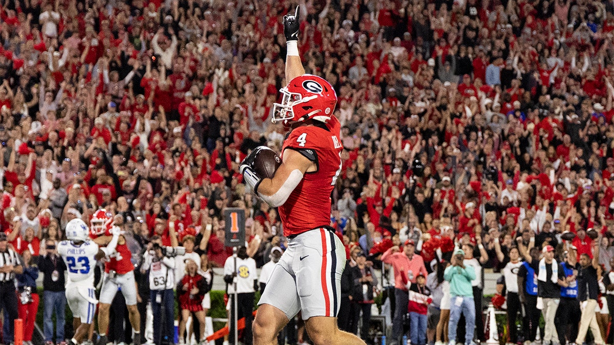 Oscar Delp celebrates a TD