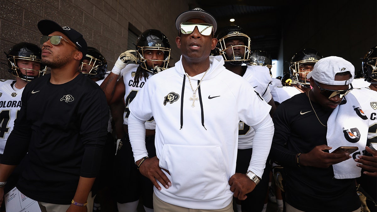 Deion Sanders prepares his team to run onto the field