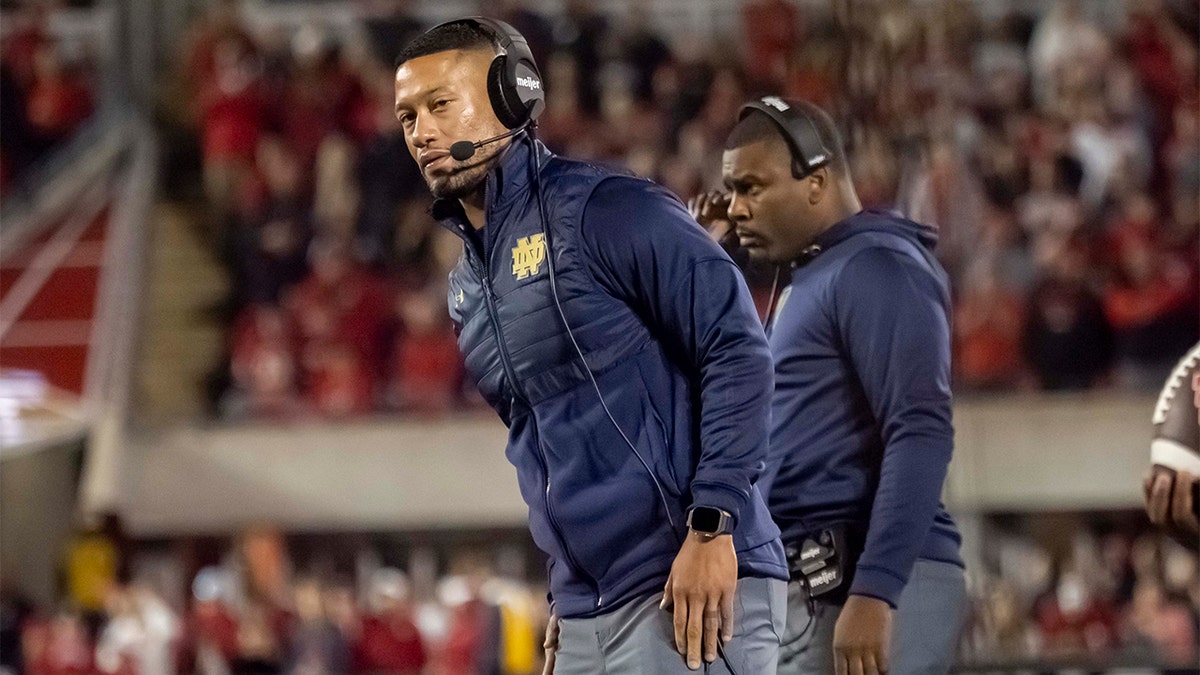 Marcus Freeman looks on against Louisville