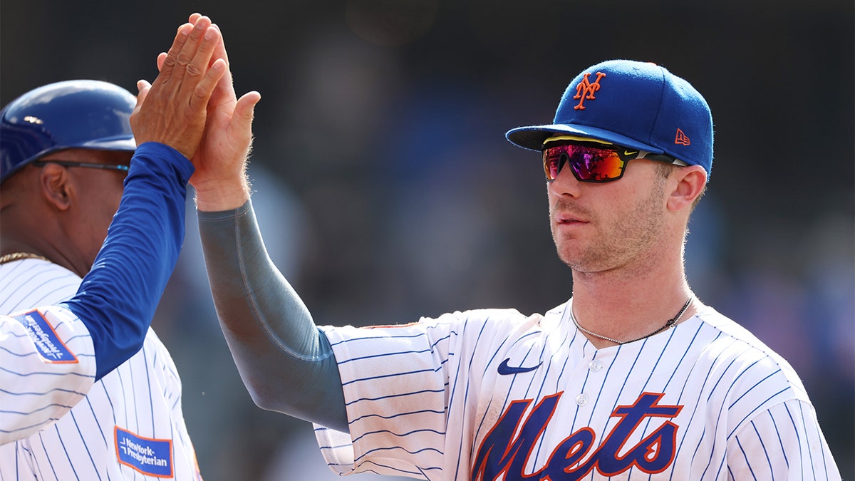 Pete Alonso celebrates after a win