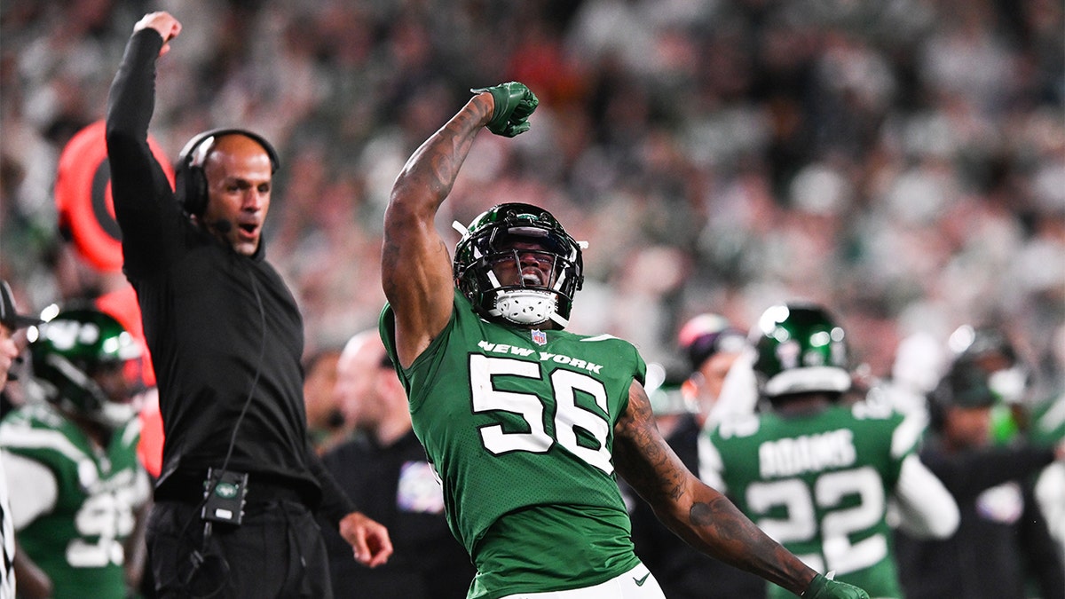 Quincy Williams celebrates a tackle