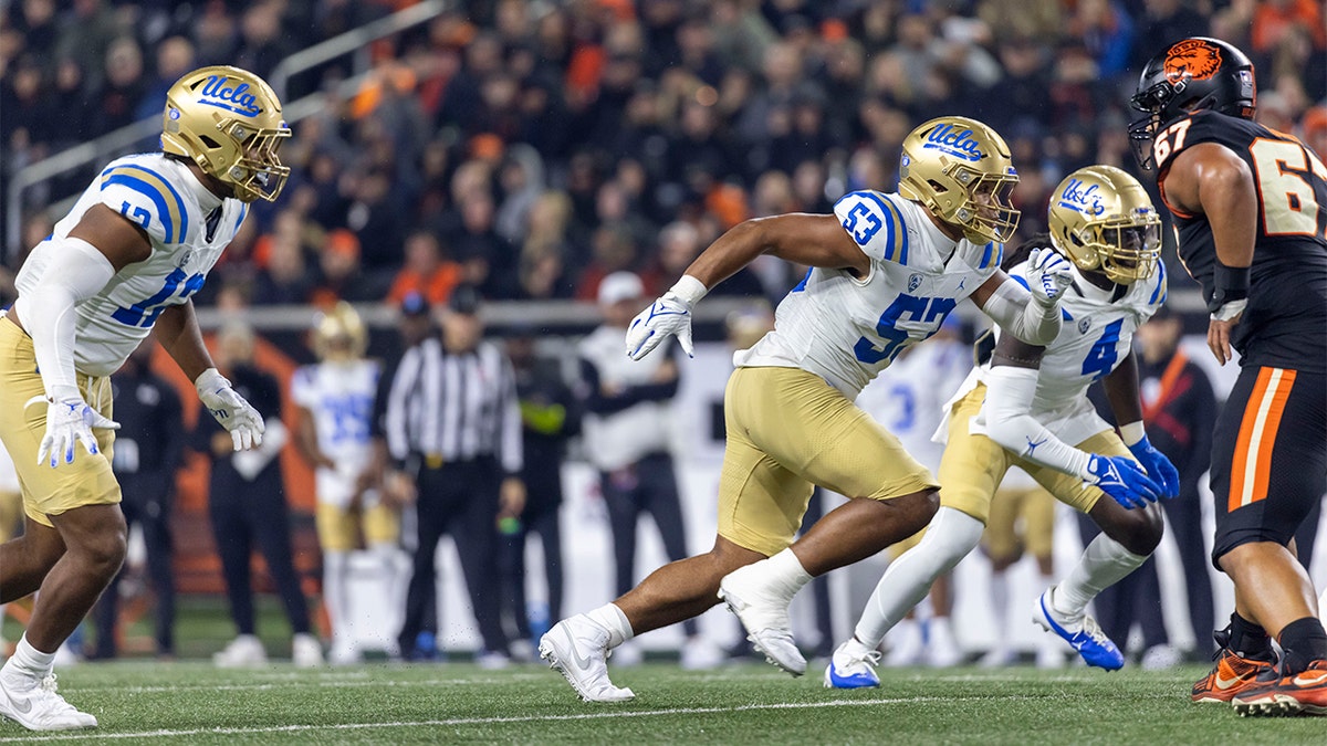 Darius Muasau rushes the quarterback