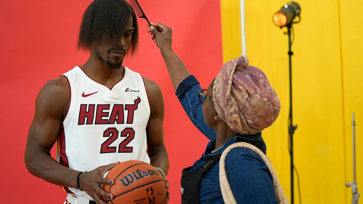 Jimmy Butler gets his hair brushed