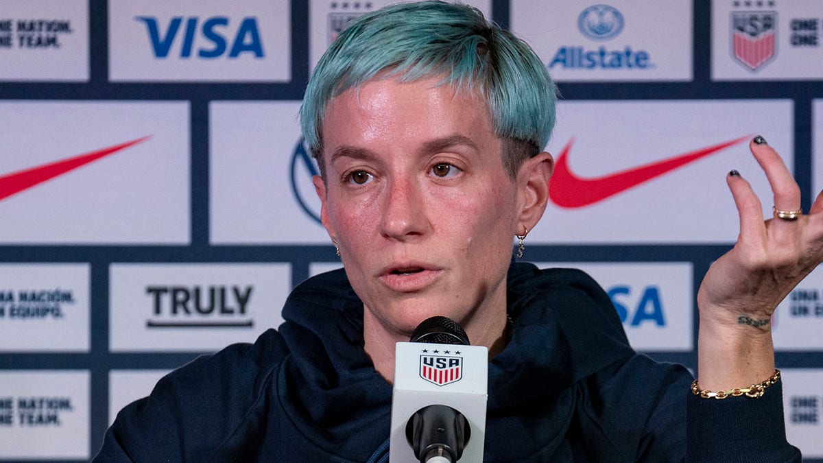 Megan Rapinoe talks to reporters