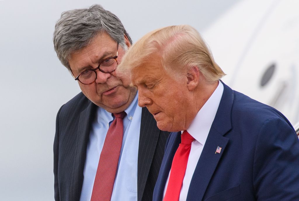 Barr speaks with Trump after the two stepped off Air Force One at Andrews Air Force Base on Sept. 1, 2020. Barr would resign three months later.
