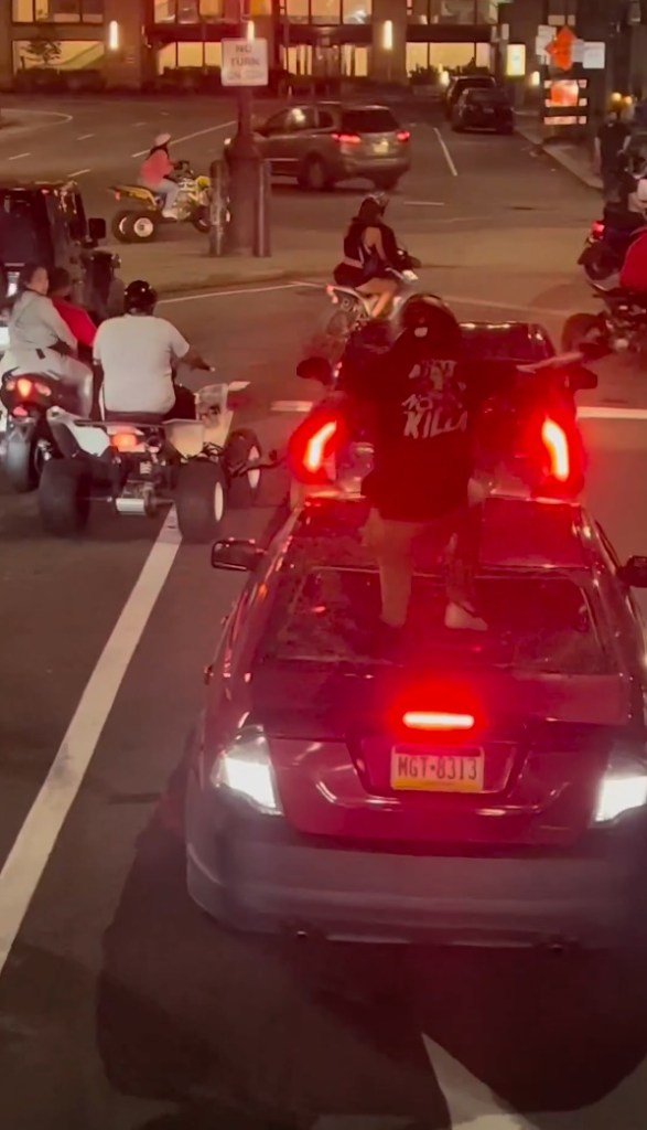 The stunning footage showed a motorcyclist stomping on the windshield. 