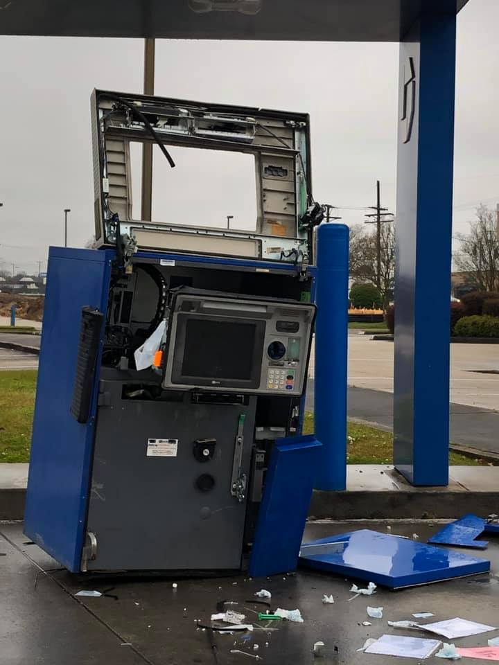A broken Chase Bank ATM is pictured. It is unclear if the gang was involved in the theft.