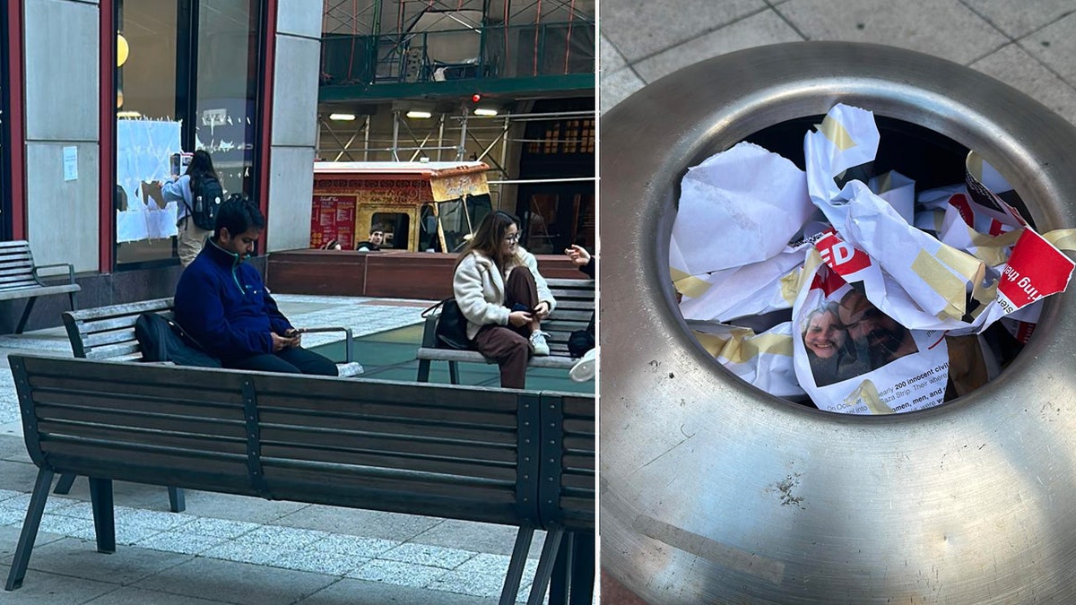 Photo of a woman tearing down posters.