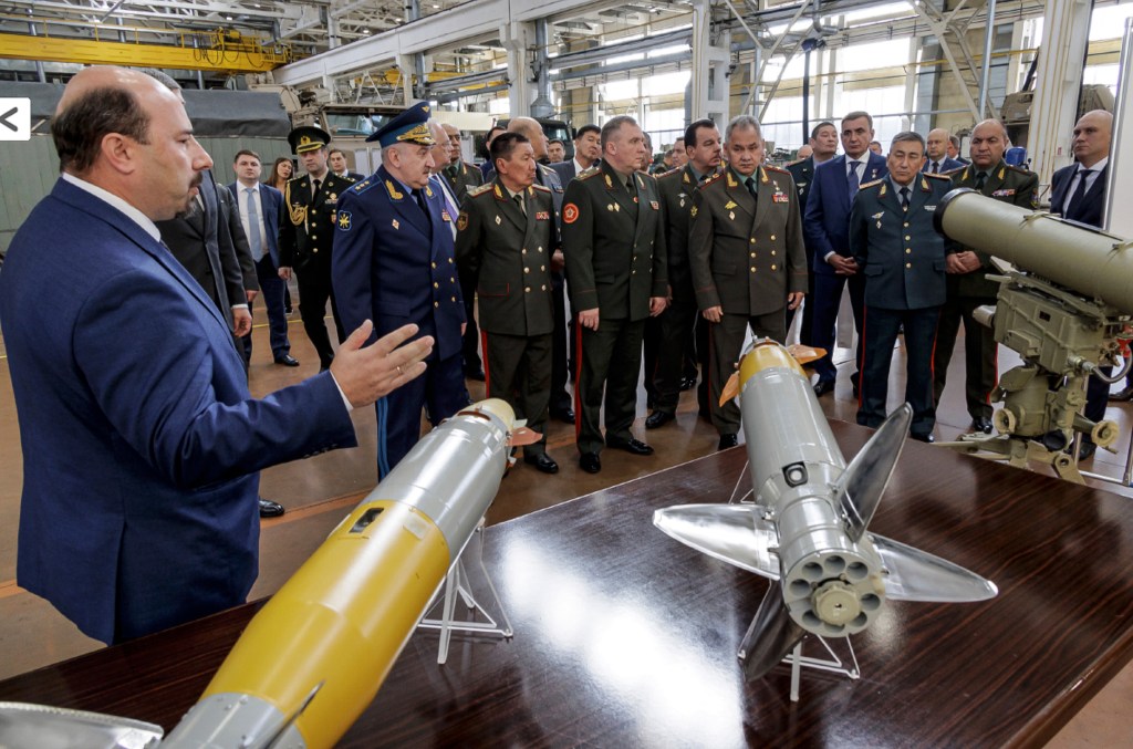 Russian Defense Minister Sergei Shoigu, center right, and Defense Ministers of the Council of Commonwealth of Independent States (CIS) visit a military plant in Tula, Russia. 