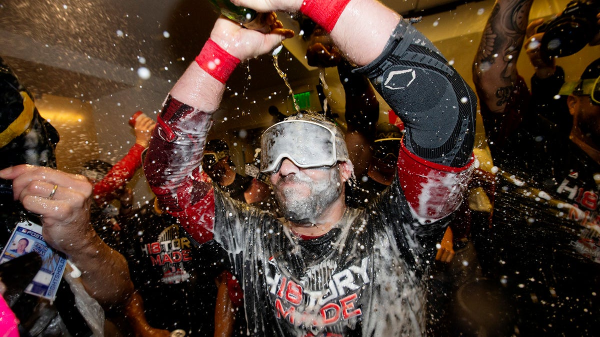 Steve Pearce covered in champagne