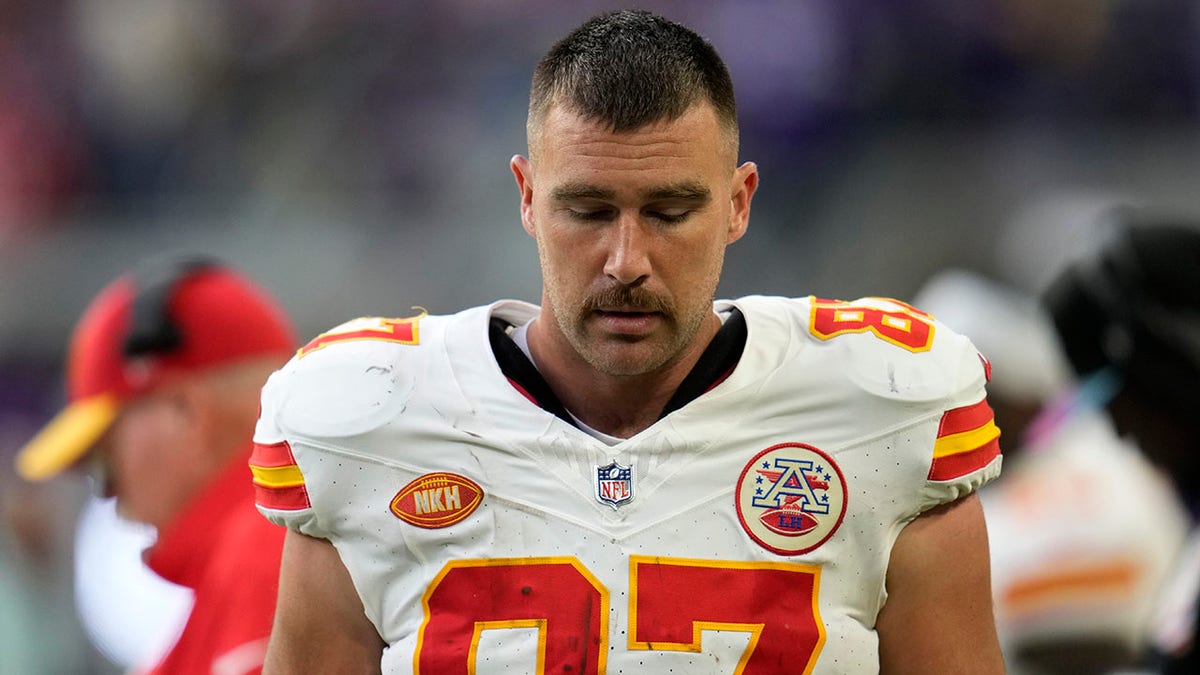 Travis Kelce looks down