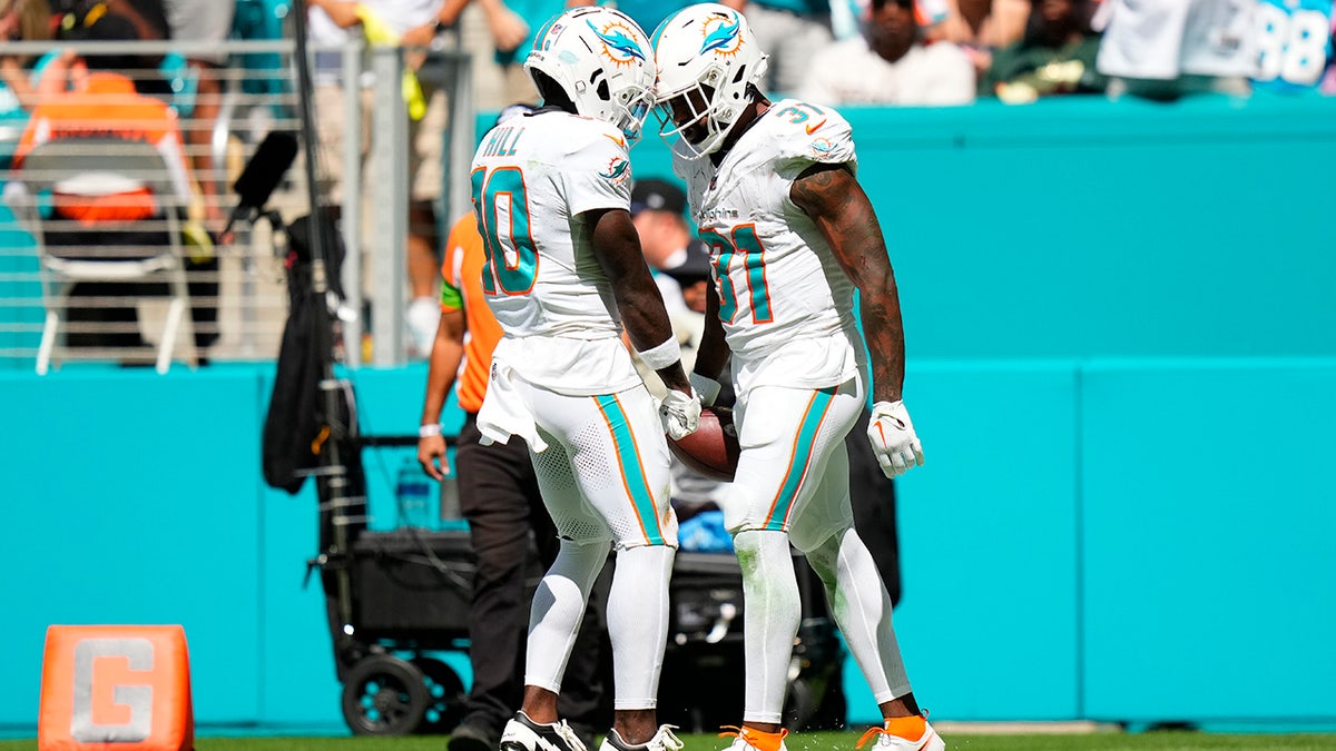 Tyreek Hill and Raheem Mostert