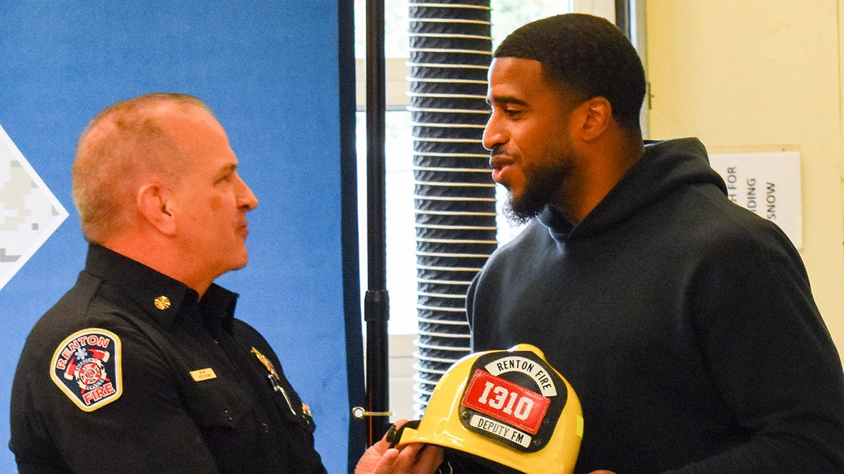 Bobby Wagner with firefighter