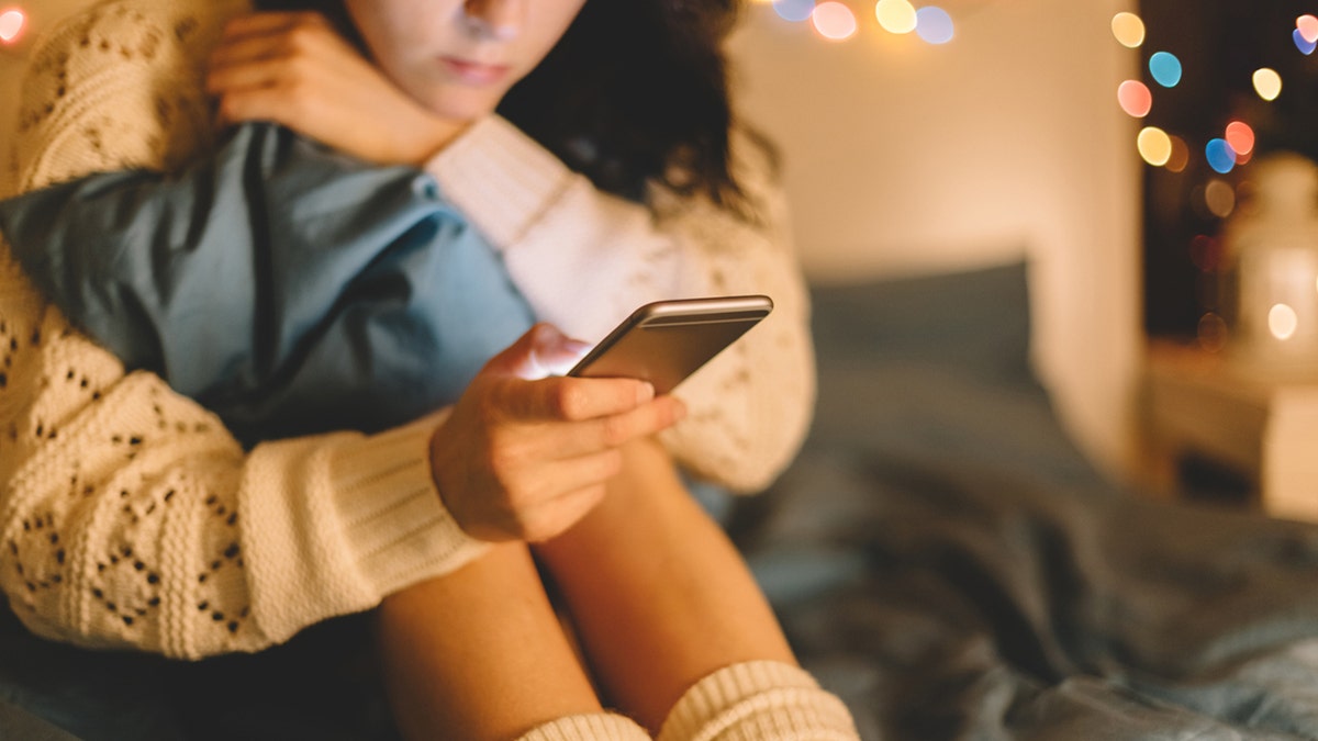 Girl texting on smartphone