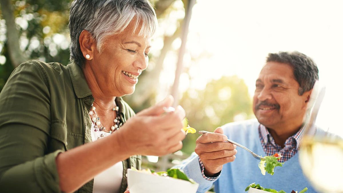 Happy older couple eating