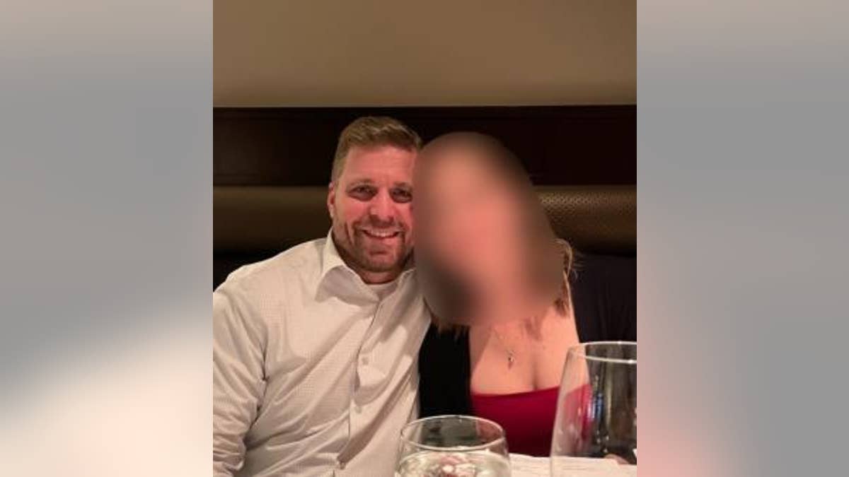 Ryan Martin fatal shooting victim poses with blurred family member or friend