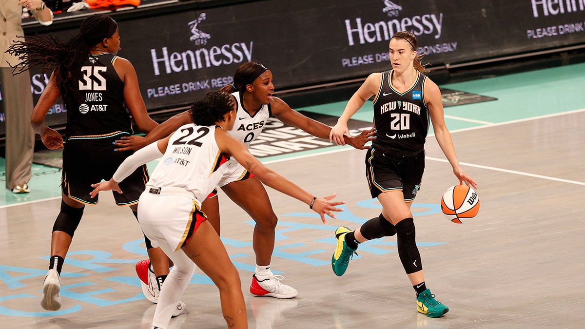 Sabrina Ionescu drives toward the net