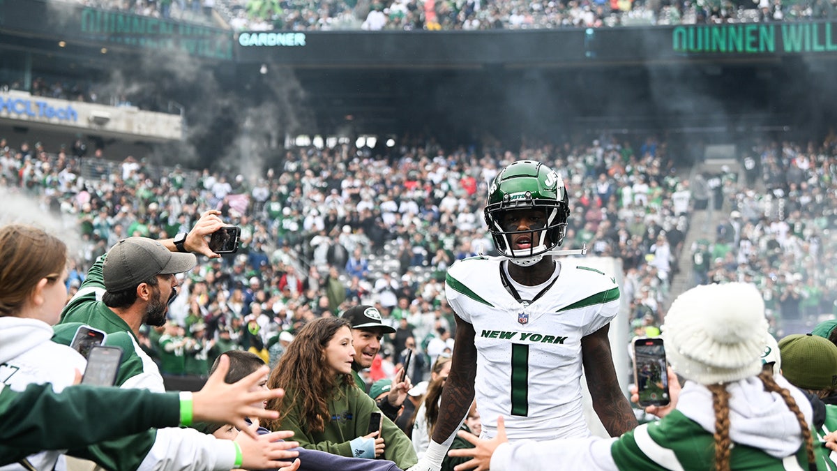 Sauce Gardner greets fans before an NFL game