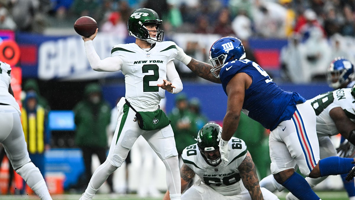 Zach Wilson looks to pass the ball